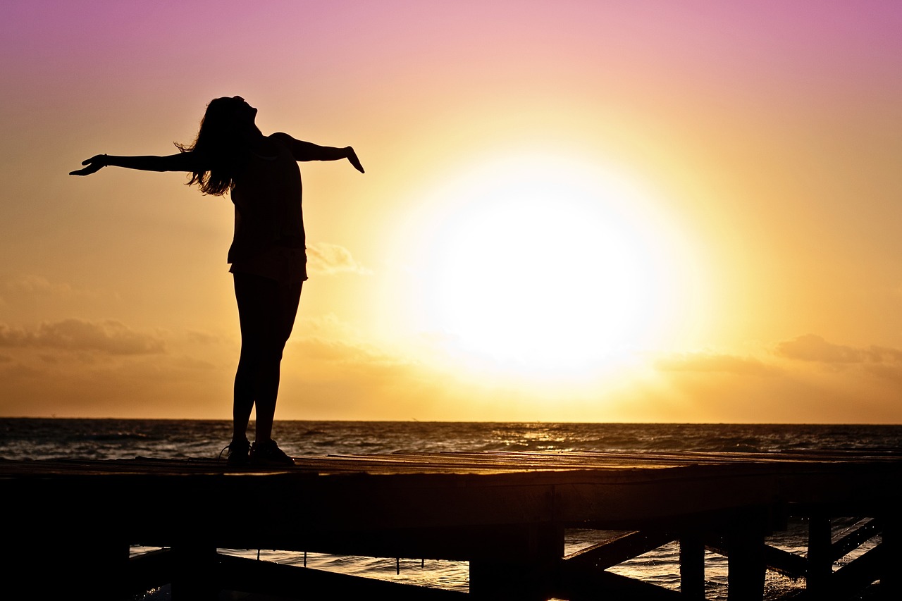 Woman at beach at sunset