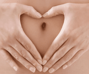 Heart hand over belly
