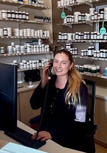 Emily on phone in reception